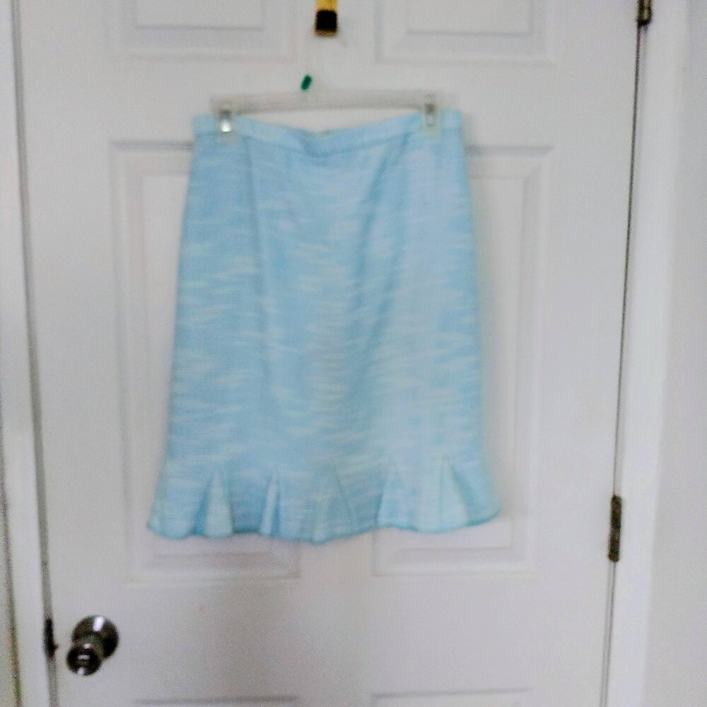 A teal colored pencil skirt with bottom flair